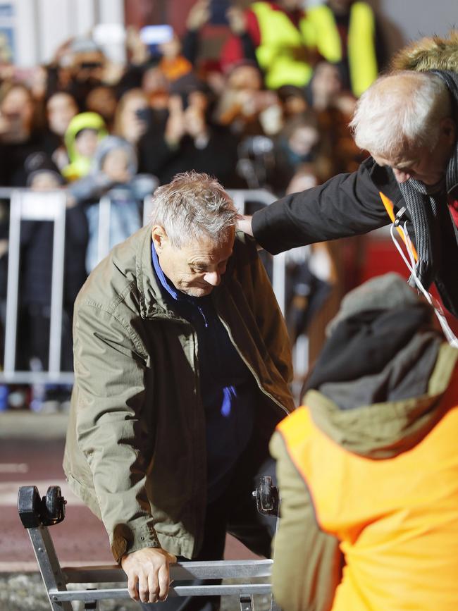 Mike Parr's emergence from beneath Macquarie Street, Hobart, where he stayed for 72 hours as part of the Dark Mofo festival last year. Picture: MATHEW FARRELL