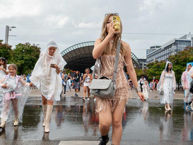 SYDNEY, AUSTRALIA - February 23, 2024, Taylor Swift fans arrived at Accor Stadium for her Sydney show under rainy weather.:   Picture: NCA NewsWire / Flavio Brancaleone