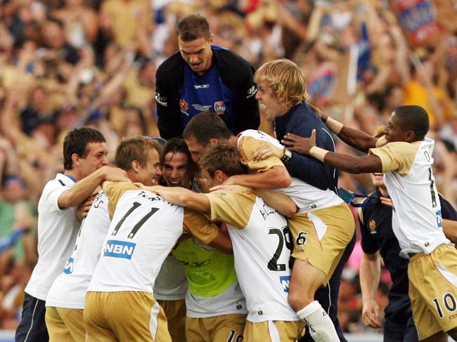 Players celebrate victory at full-time in Newcastle Jets v Central Coast Mariners 2008 A-League Grand Final match at SFS in Sydney.