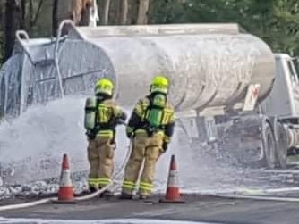 Fire and Rescue NSW crews respond to a fuel spill on Silverdale Rd after a tanker crashed. Picture: Janel Sefton