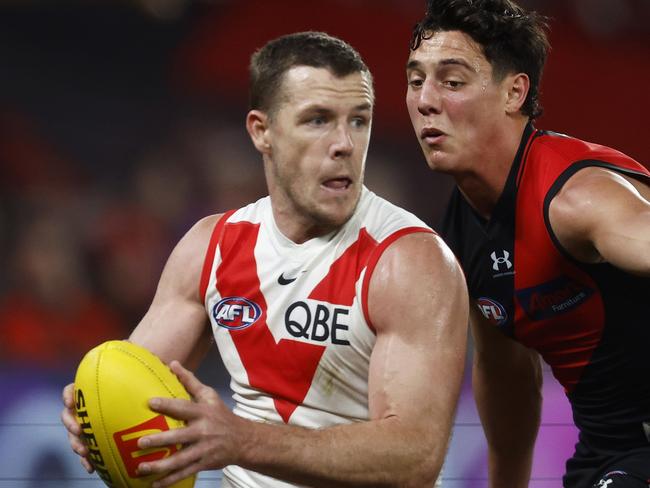 MELBOURNE, AUSTRALIA - JULY 29: Luke Parker of the Swans runs with the ball under pressure from Jye Caldwell of the Bombers during the round 20 AFL match between Essendon Bombers and Sydney Swans at Marvel Stadium, on July 29, 2023, in Melbourne, Australia. (Photo by Daniel Pockett/Getty Images)