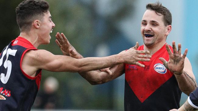 St Albans star Tim Jenkins (right) celebrates a goal in the WRFL. Picture: Local Legends Photography