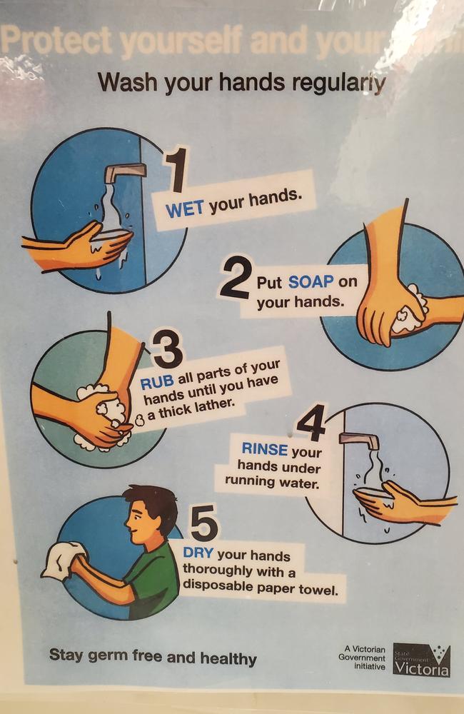 Handwashing guidelines found in a toilet in Missouri with the Victorian Government logo. Picture: Nathan Vass