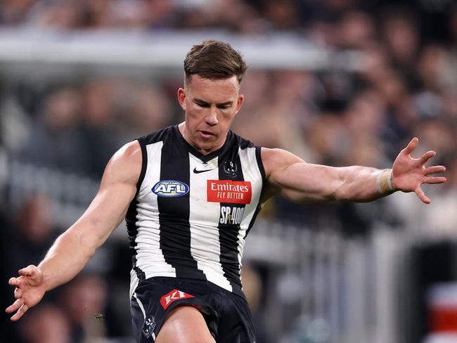 Jack Bytel gets away a kick for Collingwood against Carlton at the MCG. Picture: Mark Stewart