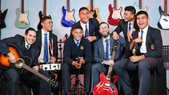 Music students Yoosuf Mohamed, Lucas Tekii, Wilkinson Papalii-Afoa, Eliiata Ulutui, Micah Papalii-Talanai and Theodore Tavete-Crysma join teacher Michael White. The students formed a band called 320 that entered and won Youthrock 2018. Picture: Richard Dobson