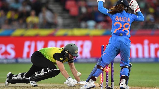 Australia’s Ellyse Perry is bowled for a golden duck by India’s Poonam Yadav as wicketkeeper Taniya Bhatia celebrates. Picture: AAP