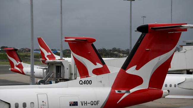 Grounded Qantas planes are seen on the tarmac at Sydney Domestic Airport after border closures were announced. Picture: NCA NewsWire/Bianca De Marchi