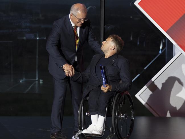 CANBERRA, AUSTRALIA - JANUARY 25: Prime Minister Scott Morrison greets Australian of the year Dylan Alcott at the 2022 Australian of the Year Awards at the National Arboretum on January 25, 2022 in Canberra, Australia. The Australian of the Year is a national award given to an Australian citizen by the National Australia Day Council. (Photo by Brook Mitchell/Getty Images)