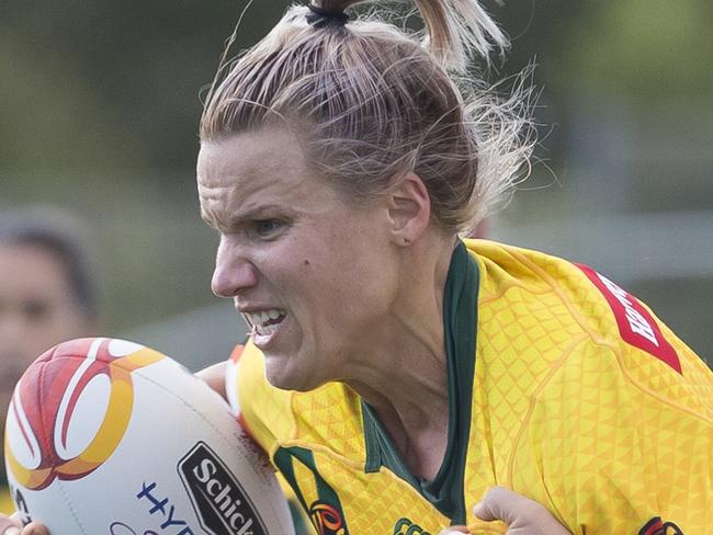 Renae Kunst of Australia (left) is tackled during the Women's Rugby League World Cup match between Australia and Canada at Southern Cross Group Stadium in Sydney, Wednesday, November 22, 2017. (AAP Image/Craig Golding) NO ARCHIVING, EDITORIAL USE ONLY