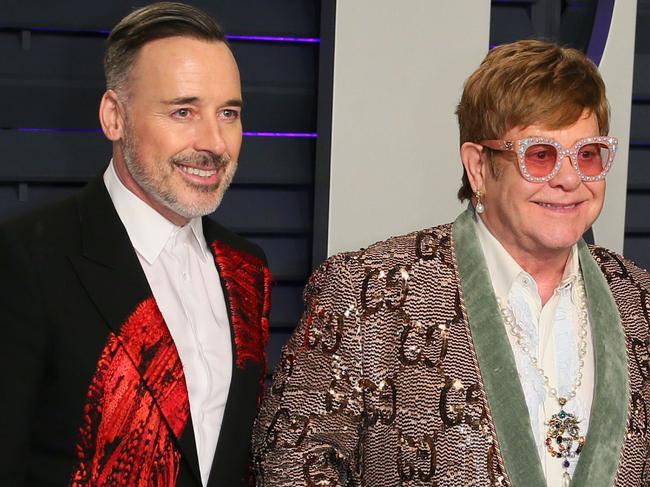 Singer/songwriter Elton John (R) and husband filmmaker David Furnish (L) attends the 2019 Vanity Fair Oscar Party following the 91st Academy Awards at The Wallis Annenberg Center for the Performing Arts in Beverly Hills on February 21, 2019. (Photo by JB Lacroix / AFP)