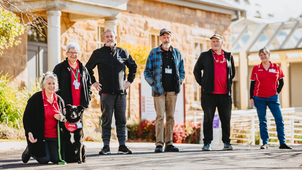 Heathcote Health volunteers Margaret Sullivan-More with Jack the Koolie, Sue Waghorne, Steve Waghorne, Barry Rasmussen, Peter Austin and Sue Pace. Picture: Chloe Smith