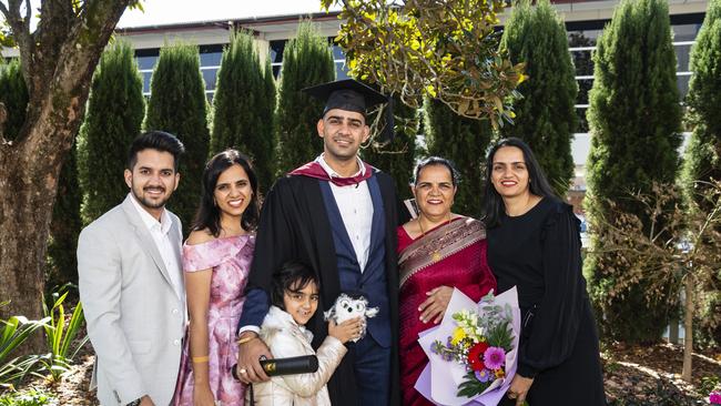 Master of Engineering Science graduate Vikram Beniwal with family (from left) Sid Saharan, Shweta Beniwal, Elina Grewal, Kamla Beniwal and Sonia Grewal at a UniSQ graduation ceremony at Empire Theatres, Wednesday, June 28, 2023. Picture: Kevin Farmer