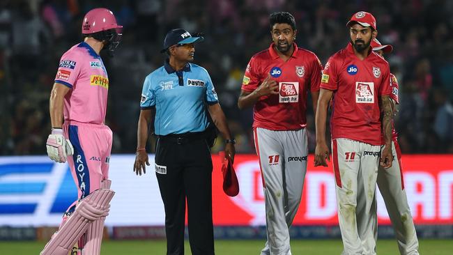 Jos Buttler (L) exchanges words with Ravichandran Ashwin after the controversial run-out which put cricket's unloved 'Mankad' dismissal in the spotlight (Photo by Money SHARMA / AFP) /