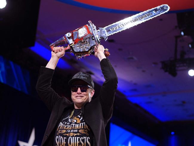 Elon Musk wields the “chainsaw of democracy” at the Conservative Political Action Conference (CPAC) in Maryland. Picture: Andrew Harnik / Getty