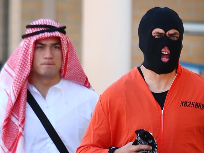 Tapai Moeroa (tea towel) and Brad Takairangi (balaklava) Parramatta Eels players pictured on their Mad Monday celebrations arriving at The Royal Oaks Hotel in Parramatta.NO PHOTO CAPTION PLEASE.