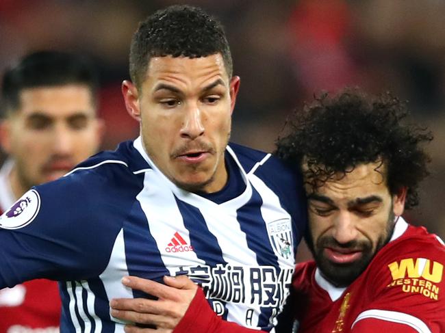 LIVERPOOL, ENGLAND - DECEMBER 13:  Jake Livermore of West Bromwich Albion is challenged by Mohamed Salah of Liverpool during the Premier League match between Liverpool and West Bromwich Albion at Anfield on December 13, 2017 in Liverpool, England.  (Photo by Clive Brunskill/Getty Images)