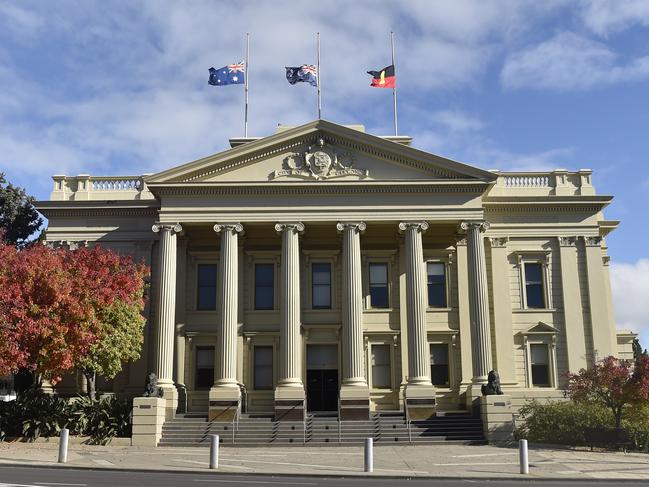 Flags flying half mast at City Hall. Marchers took part in an Anzac Parade through Malop Street to Johnstone Park on Anzac Day. Crowds lined the street but there were none of the usual formalities at the finale. Picture: Alan Barber