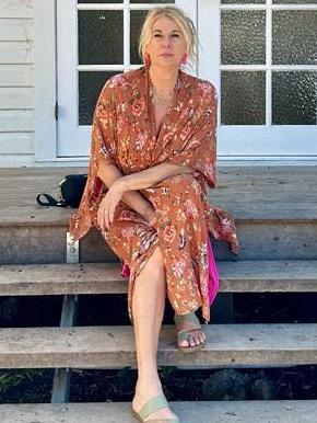 Mandy Nolan sitting outside Fletcher Street Cottage at Byron Bay. Picture: Supplied