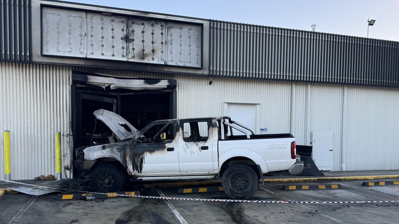 A burnt out ute at the front of a Strathpine tobacconist which was rammed on Wednesday night.