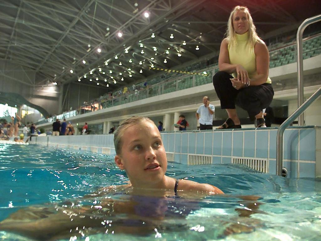 Jaimi, then 14, with her mum at Sydney Aquatic Centre in April 2002. Picture: Mark Evans