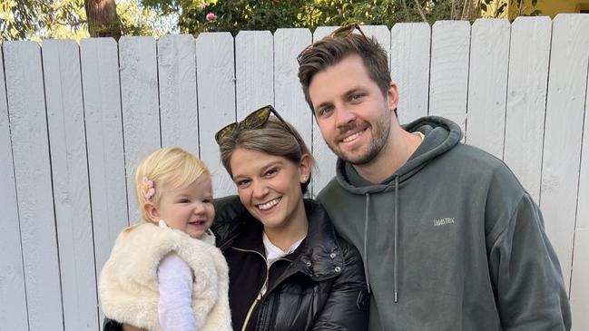 Mitch Keough and partner Amelia Perry with child Charlotte, 15 months.