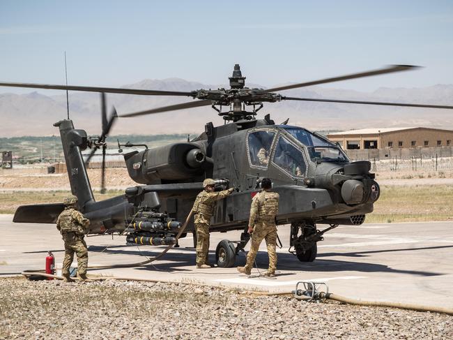 MR244X U.S. Army Soldiers assigned to Task Force Warhawk, 16th Combat Aviation Brigade, 7th Infantry Division refuel an AH-64 Apache helicopter in Uruzgan Province, Afghanistan, May 1, 2017. The Warhawks are working hard to support U.S. Forces Afghanistan as part of Operation Freedom's Sentinel and Resolute Support Mission.