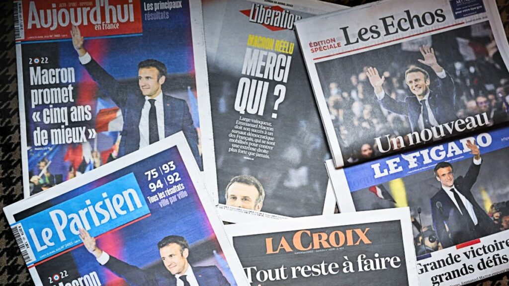 PARIS, FRANCE - APRIL 25: Front pages of the French newspapers show France's centrist incumbent president Emmanuel Macron after beating his far-right rival Marine Le Pen for a second five-year term on April 25, 2022 in Paris, France. (Photo by Jeff J Mitchell/Getty Images)