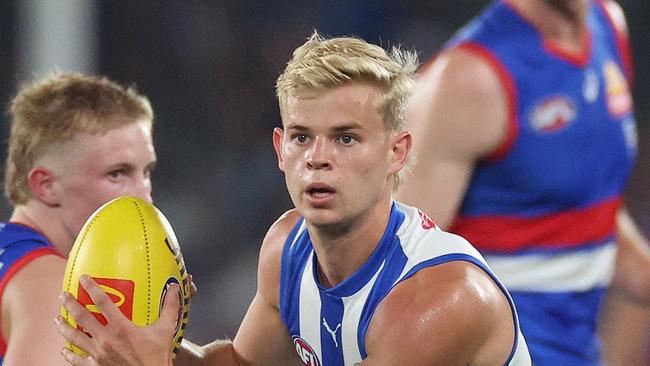 MELBOURNE, AUSTRALIA - MARCH 15: Jackson Archer of the Kangaroos looks to pass the ball during the round one AFL match between Western Bulldogs and North Melbourne Kangaroos at Marvel Stadium, on March 15, 2025, in Melbourne, Australia. (Photo by Daniel Pockett/Getty Images)