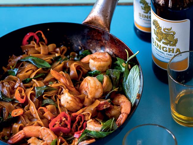 EMBARGO FOR TWAM 01 JUNE 2024. FEE MAY APPLY. Images and text from Thai Home Cooking by Orathay Souksisavanh, photography by Akiko Ida. Murdoch Books RRP $49.99. Pad Kee Mao, stir fried rice noodles with prawns, Chili and Thai Basil. Photo: Akiko Ida / Supplied