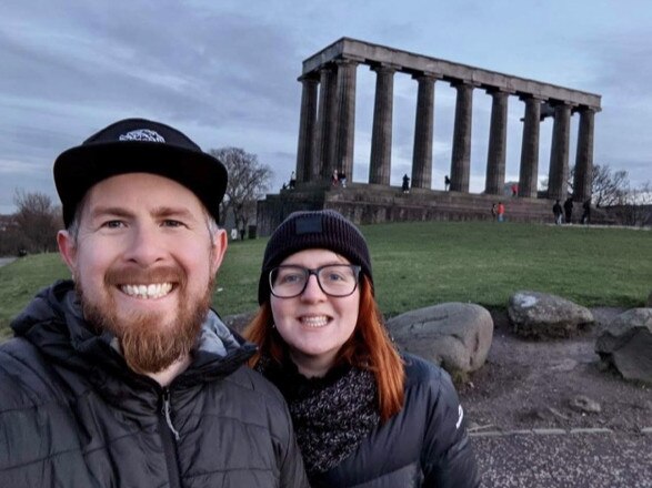 Amy Webster, of Brisbane, and Ben Goodwin, of Adelaide, both 31, are couch surfing after their flights home were cancelled because of the Australian Government's flight caps. Picture: Supplied