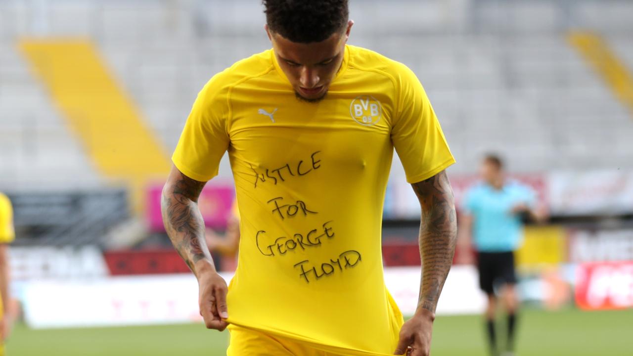 Jadon Sancho shows a "Justice for George Floyd" shirt after scoring a goal.