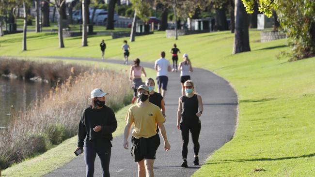 People enjoy the Spring weather along the Yarra River for their daily exercise as Melbourne is still in lockdown. Picture: NCA NewsWire / David Crosling