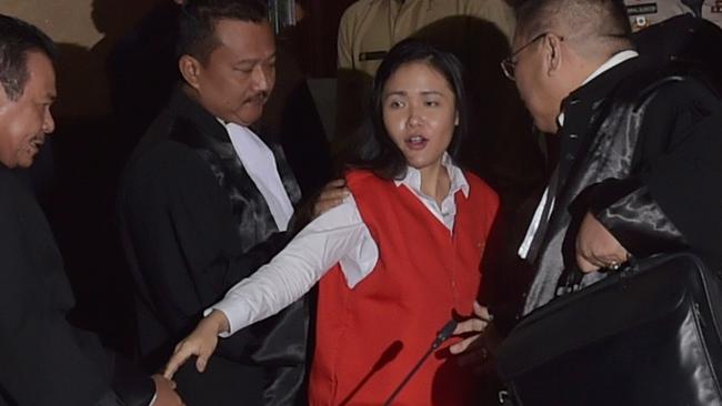 Indonesian suspect Jessica Kumala Wongso is guarded by her lawyers after her trial at the Central Jakarta court in Jakarta on June 15, 2016. Picture: AFP