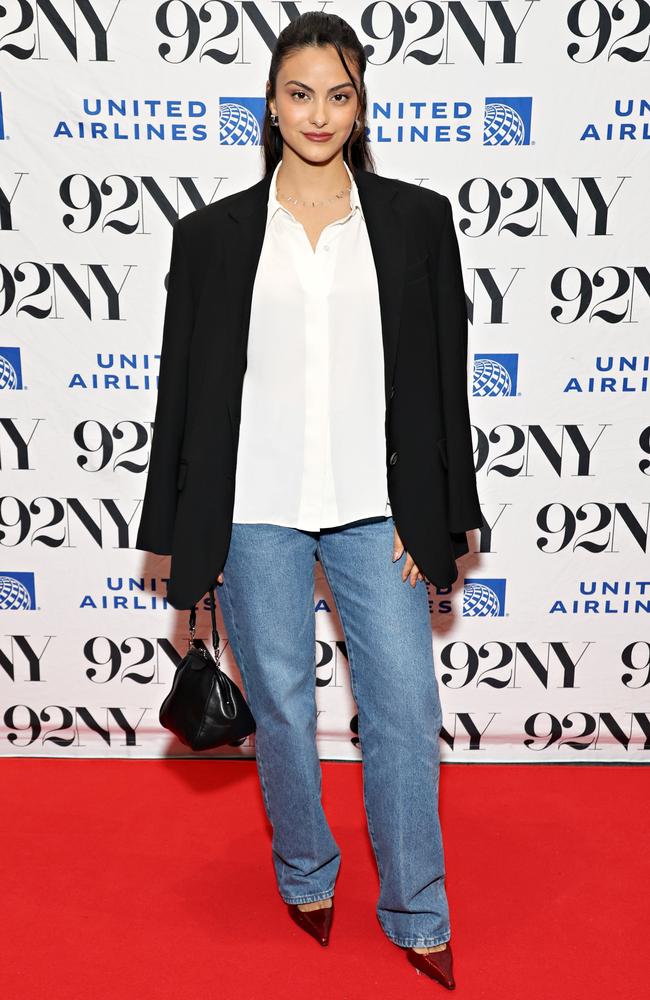 Camila Mendes really dialled it in for a screening of her new movie Música - which has a 100% rating on Rotten Tomatoes, wild - in a ‘smart-minimalism’ ‘fit of white button-up, black blazer and blue jeans. Picture: Cindy Ord/Getty Images