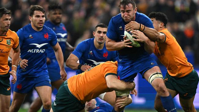 France's Anthony Jelonch is tackled by two Wallabies during Australia’s disappointing loss at Stade de France in Paris at the weekend. Picture: AFP