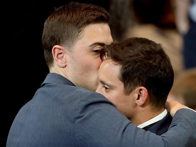 Two men hug as they react to the voting results at Democratic presidential nominee former Secretary of State Hillary Clinton’s election night event at the Jacob K. Javits Convention Center November 9, 2016 in New York City. Clinton is running against Republican nominee, Donald J. Trump to be the 45th President of the United States. John Moore/Getty Images/AFP == FOR NEWSPAPERS, INTERNET, TELCOS & TELEVISION USE ONLY ==