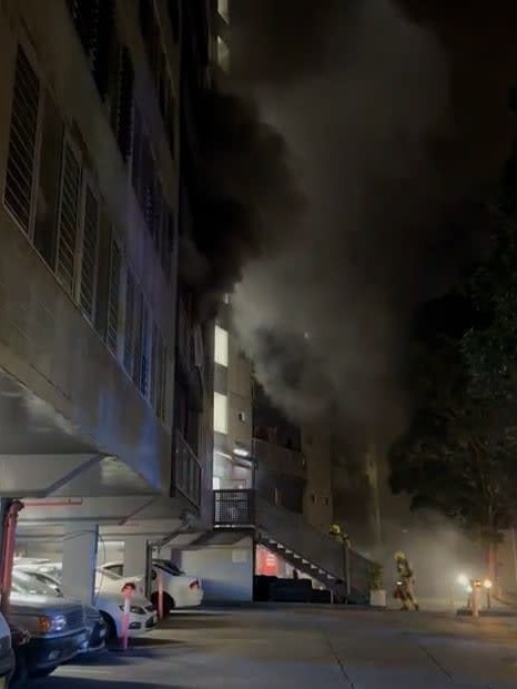 Firefighters enter a unit building in Camperdown in the early hours of Monday. Picture: Fire and Rescue NSW