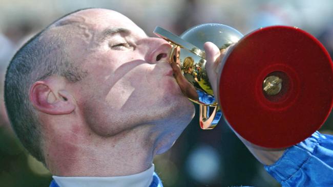 Glen Boss finally got his first Melbourne Cup trophy in 2003. Picture: Michael Dodge