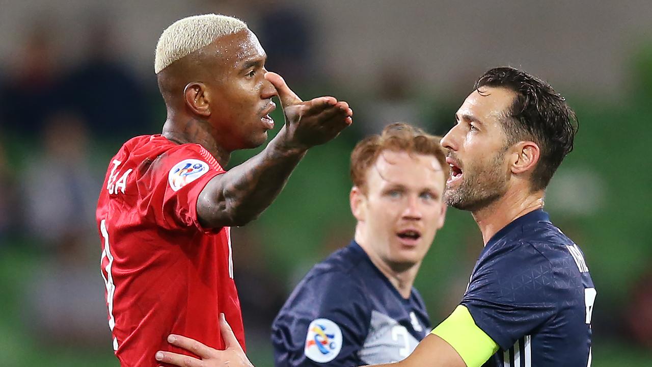 Anderson Talisca of Guangzhou Evergrande gestures to the referee as Carl Valeri of the Victory steps in