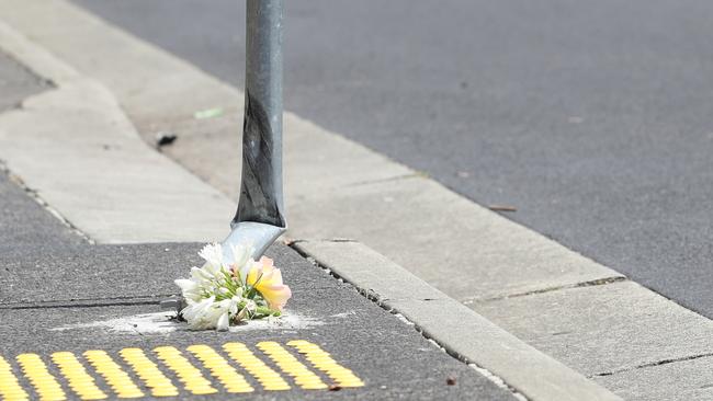 Flowers lay at the scene where a teenager riding a motorcycle was killed last on Harbord Road, Claremont. Picture: Zak Simmonds