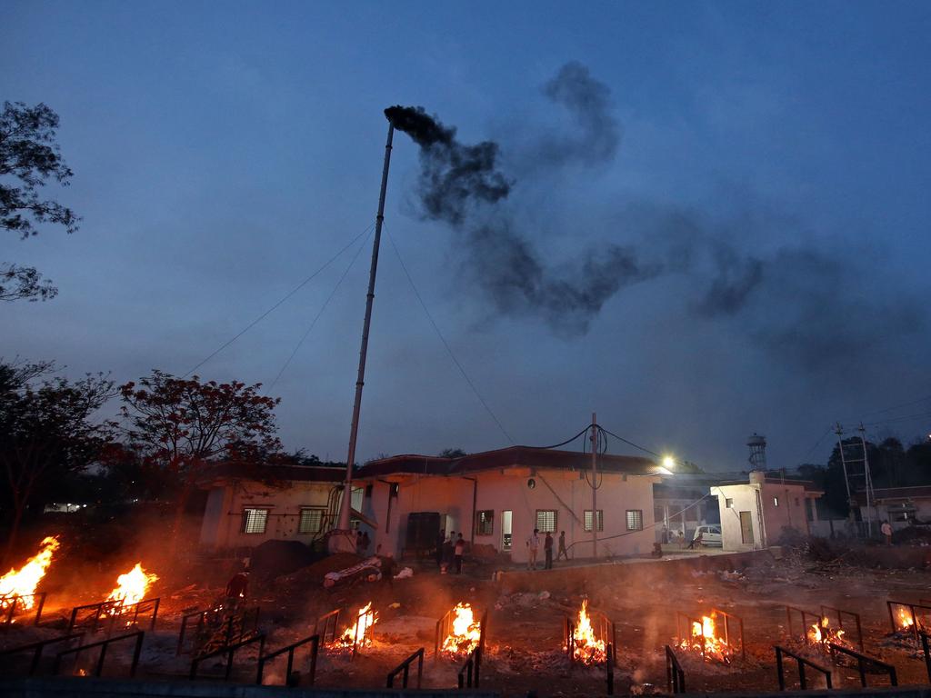 Burning pyres of victims who lost their lives due to coronavirus are seen at a crematorium in Bhopal. Picture: AFP