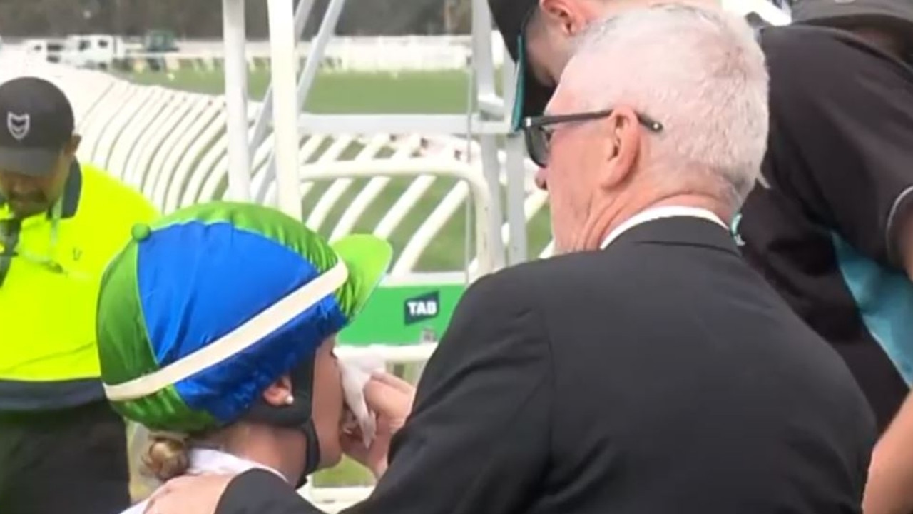 Jamie Kah has her nose inspected after copping a blow from Hurry Curry. Picture: 9News