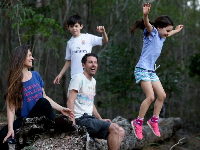 Scott and Amy Robertson with children Elkie, 7, and Charlie, 10 at Mt Coot-tha. Picture: Mark Calleja/AAP