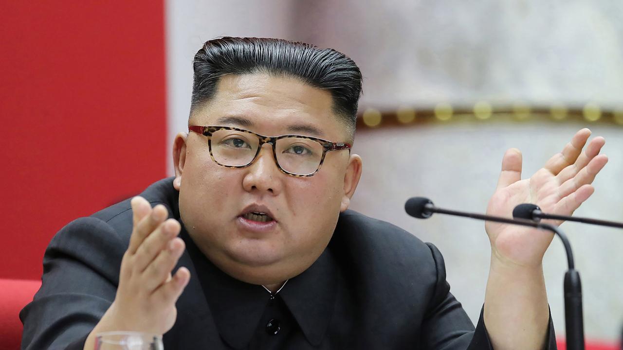 Kim Jong-un is in “a vegetative state” in a coma following a botched heart operation, according to new reports. (Photo by STR / KCNA VIA KNS / AFP)