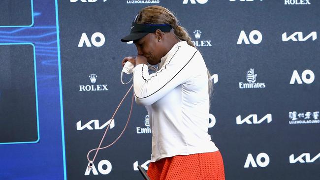 Serena Williams walks out of her press conference. Picture: AFP PHOTO /ROB PREZIOSO/ TENNIS AUSTRALIA