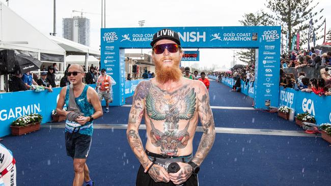 Gold Coaster Jake Malby finishes the 2019 Gold Coast Marathon. He will run 31 marathons in 31 days in August.