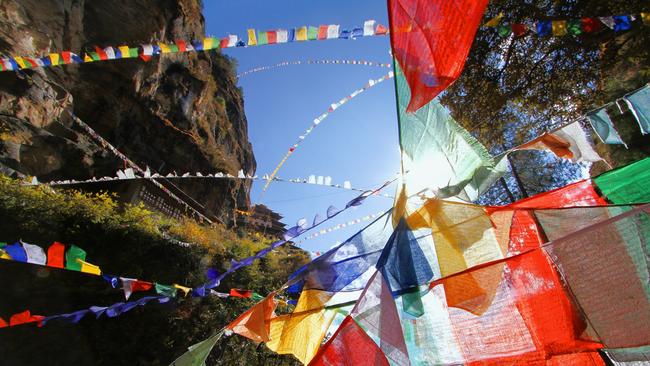 Colorful Buddhist prayer flags at Taktshang Goemba or Tiger's nest monastery in Paro, Bhutan.