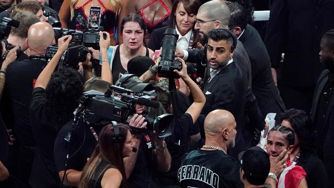 The crowd was stunned when Taylor was awarded the fight. (Photo by TIMOTHY A. CLARY / AFP)