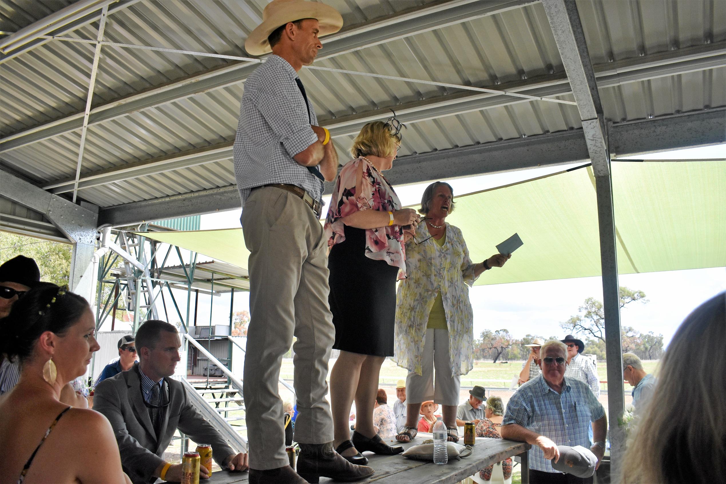 Maranoa Diggers Race Club president Rowan Douglas, Ann Leahy and Club secretary Jan Chambers make an announcement. Picture: Jorja McDonnell