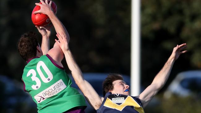 Marcus Nolan of Old Paradians marks during the VAFA match between Old Paradians and Whitefriars played at Bundoora on Saturday 26th May, 2018.